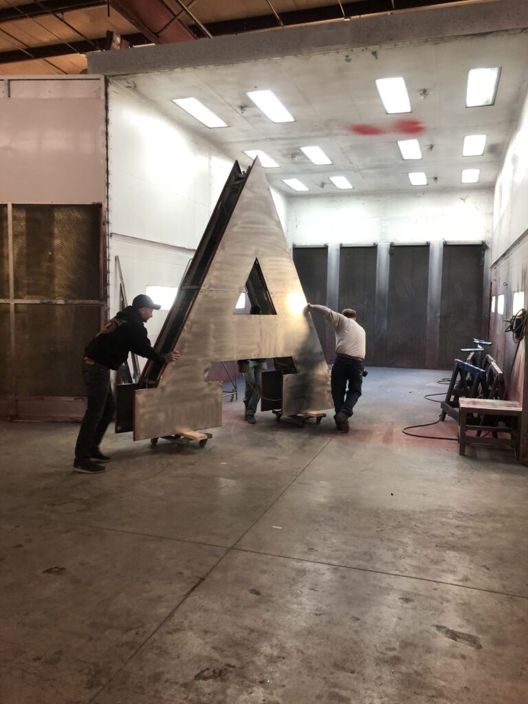 Manufacturing arborland pylon sign in shop at Ypsilanti, MI