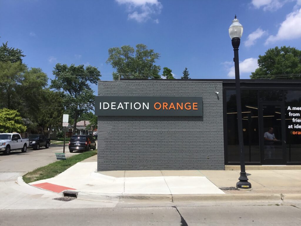 Ideation Orange wall sign in Hazel Park, MI