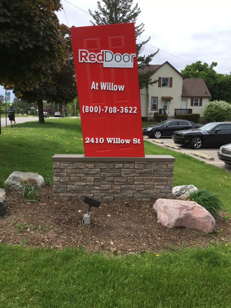 Red Door Apartments monument sign in Webberville, MI