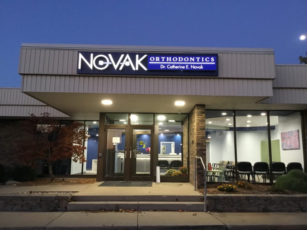 Novak Orthodontics wall sign in Holt, MI