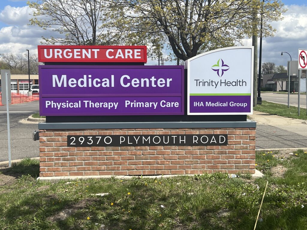 Trinity Health IHA Medical Group monument sign in Livonia, MI