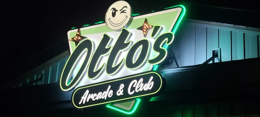 Custom dimensional wall sign with LED lighting at night